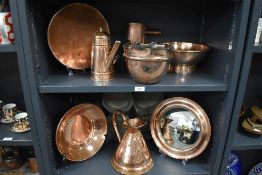 A selection of antique and later copper wares including convex bullseye mirror, bowls, jug and
