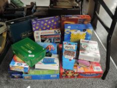 A selection of children's board games and puzzles including MB Crossword, Trivial Persuit and