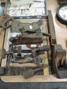 A selection of antique wood working tools including brass body block plane and brass body shoulder