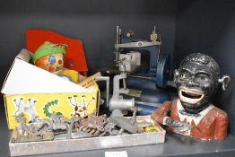 A collection of mixed Toys including Ethnic Money Box, Lead Soldiers, Vulcan Sewing Machine,