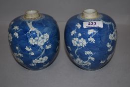 A pair of fine Chinese export porcelain ginger jars decorated with cracked ice and prunus having