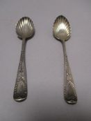 A pair of early 20th century tea spoons HM silver having scalloped bowl with bright cut