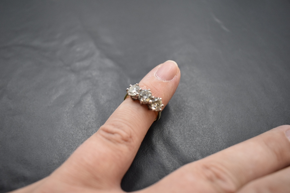 A diamond trilogy ring, total approx 2.20ct in a raised claw set mount on an 18ct gold loop, size - Image 3 of 3