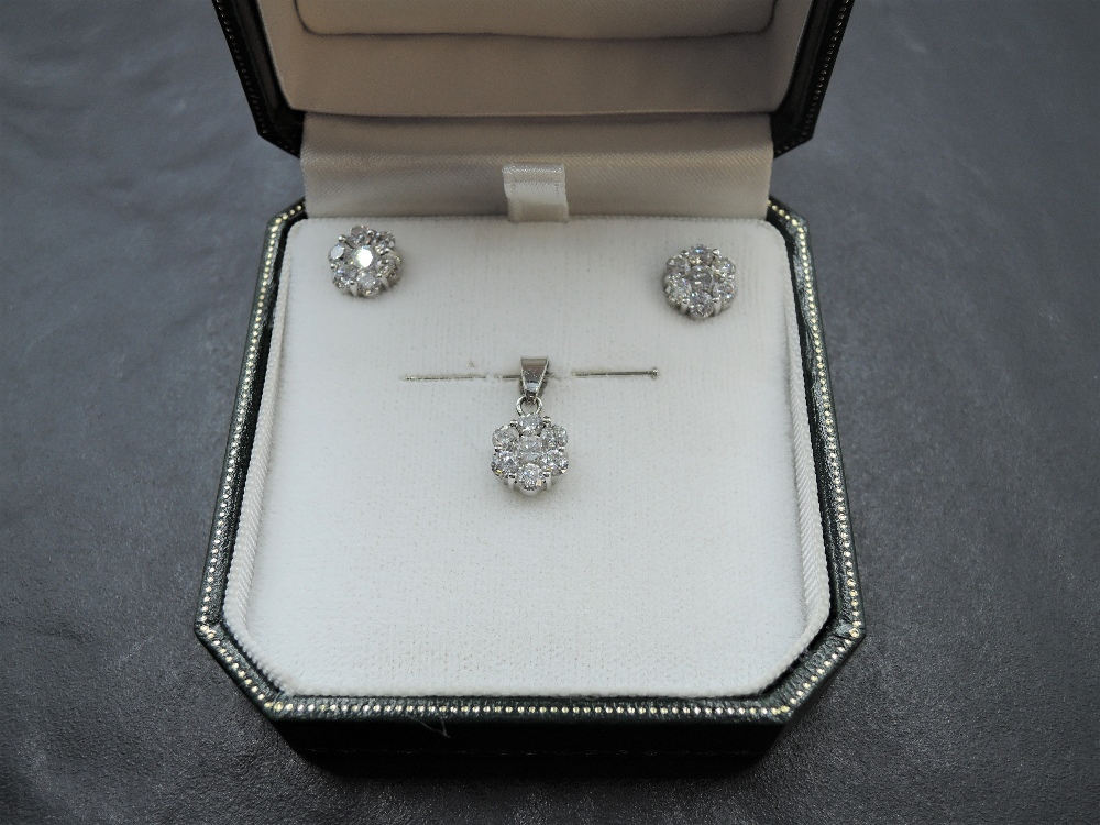 A pair of seven stone diamond cluster stud earrings, each approx 0.5ct in 18ct white gold mounts