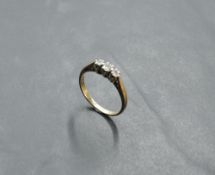 A diamond trilogy ring, total approx 0.15ct in claw set mount on a 9ct gold loop, size L & approx