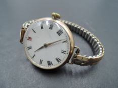 A gent's vintage 9ct gold wrist watch by Longines bearing no:4014163 to case, having Roman numeral