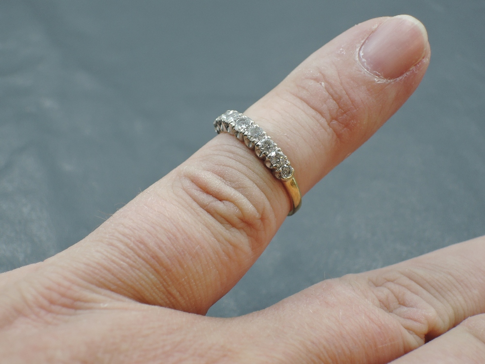 A nine stone diamond half eternity ring in claw set mounts on an 18ct gold loop, size L & approx 2. - Image 3 of 4