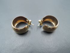 A pair of 9ct gold hoop earrings of plain polished form, approx 2.9g