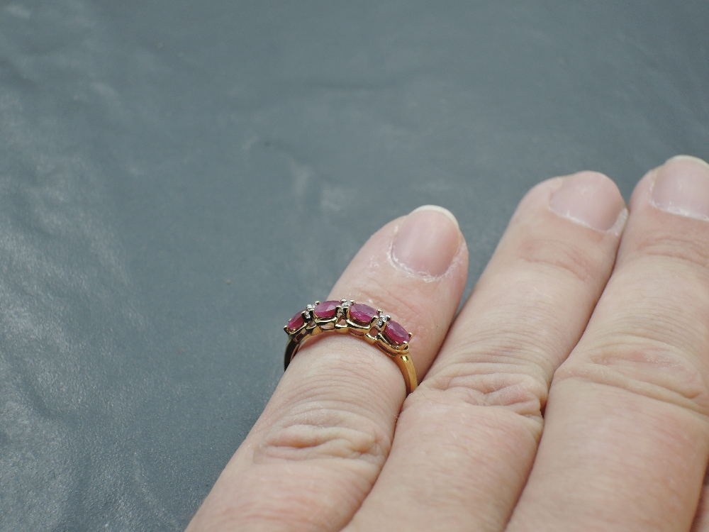 A 9ct gold dress ring having four oval ruby style stones with diamond chip spacers on a 9ct gold - Image 3 of 3