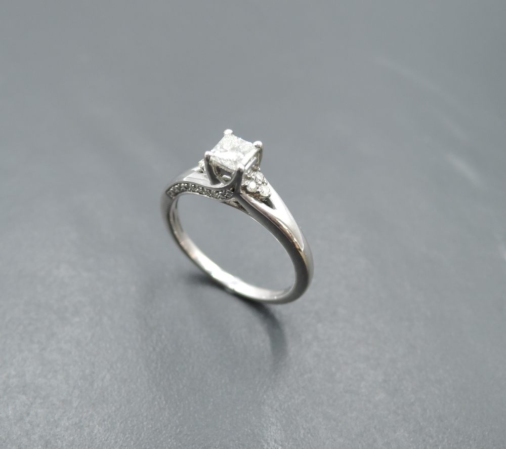A diamond solitaire dress ring having a princess cut diamond, approx 0.4ct in a 4 claw mount to