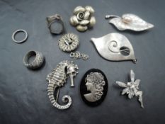 A vintage box containing a selection of HM silver and white metal jewellery (most stamped silver/