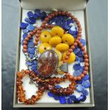 A lapis lazuli carved teardrop bead necklace, Baltic amber bracelet, amber style loose beads and