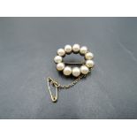 A Victorian split pearl and yellow metal brooch of petit oval form, no marks tests as gold