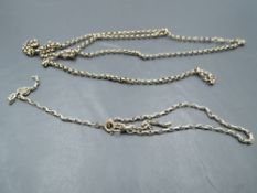 Two pieces of broken yellow metal chain, no marks, approx 12.8g