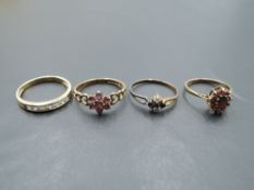 Four 9ct gold dress rings including garnet cluster, ruby cluster, CZ half eternity and sapphire