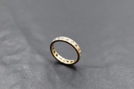 A 9ct gold full eternity ring having diamond chip decoration, size N & approx 2.8g