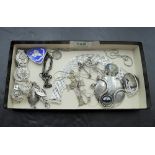 A selection of HM silver and white metal jewellery including bracelets, locket, pendants, Nursing