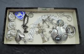 A selection of HM silver and white metal jewellery including bracelets, locket, pendants, Nursing