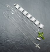 A Mexican silver bracelet having Aztec design panels and three silver necklaces including green