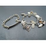 A white metal charm bracelet having eighteen HM silver and white metal charms including penny