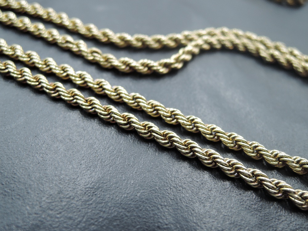 A yellow metal rope link guard chain having moulded clasped fist clasp fitting, no marks tests as - Image 3 of 3