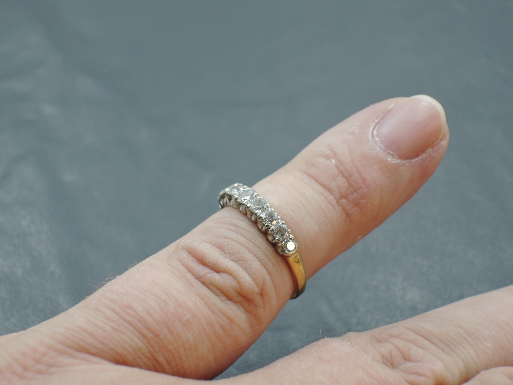 A nine stone diamond half eternity ring in claw set mounts on an 18ct gold loop, size L & approx 2. - Image 4 of 4