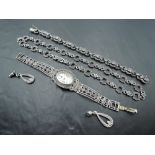 Three pieces of silver and marcasite jewellery including necklace, bracelet and quartz wrist watch