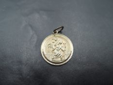 A 9ct gold St Christopher pendant, approx 3.7g