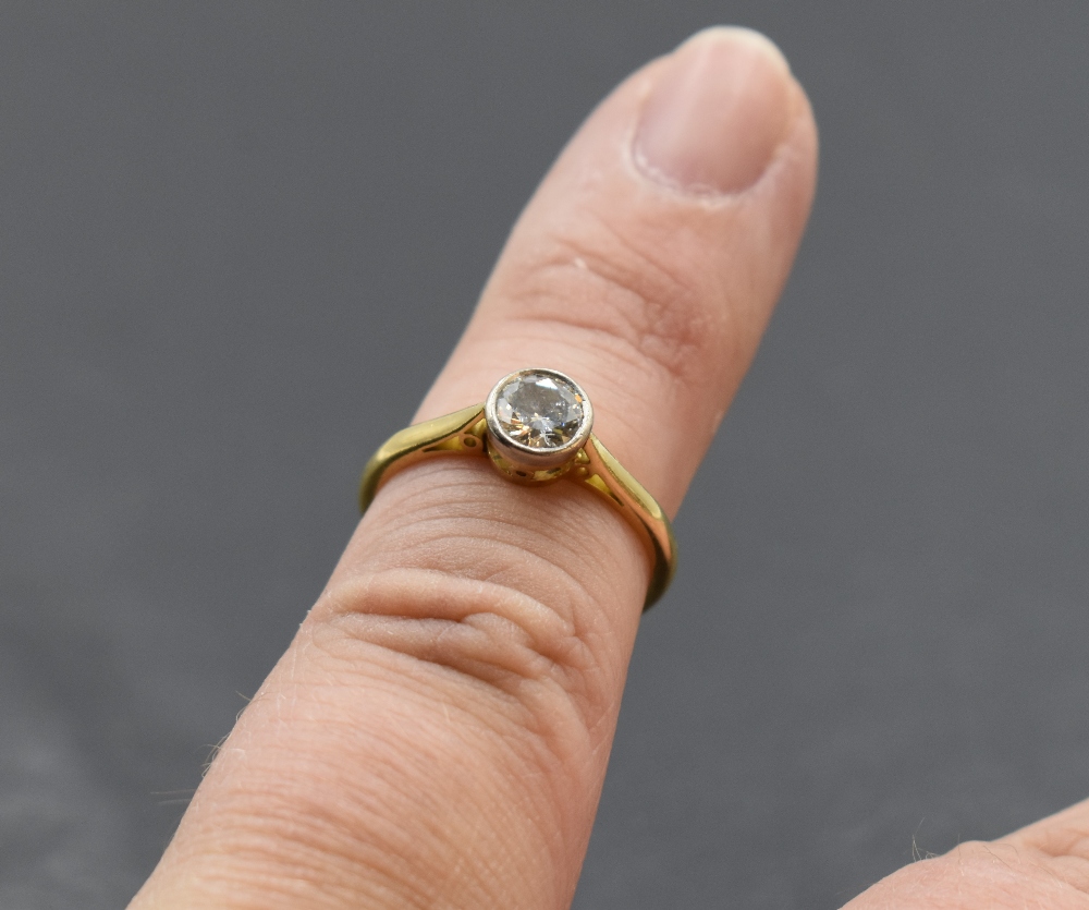 A diamond solitaire dress ring, approx 0.60ct in a collared mount on an 18ct gold loop, size M & - Image 3 of 3