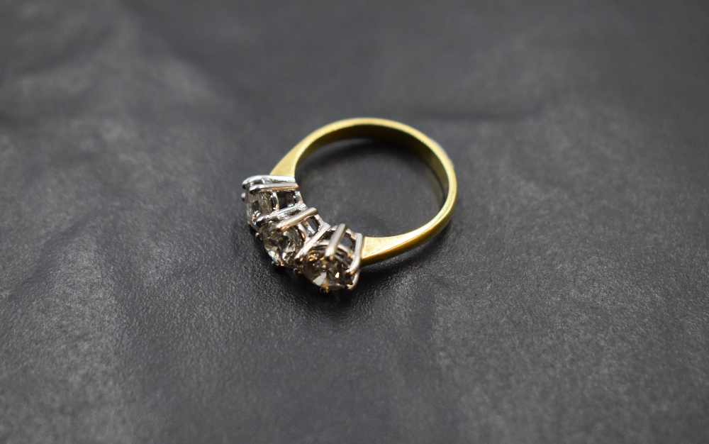 A diamond trilogy ring, total approx 2.20ct in a raised claw set mount on an 18ct gold loop, size - Image 2 of 3