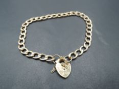 A 9ct gold open curb link bracelet having padlock clasp, approx 3.1g