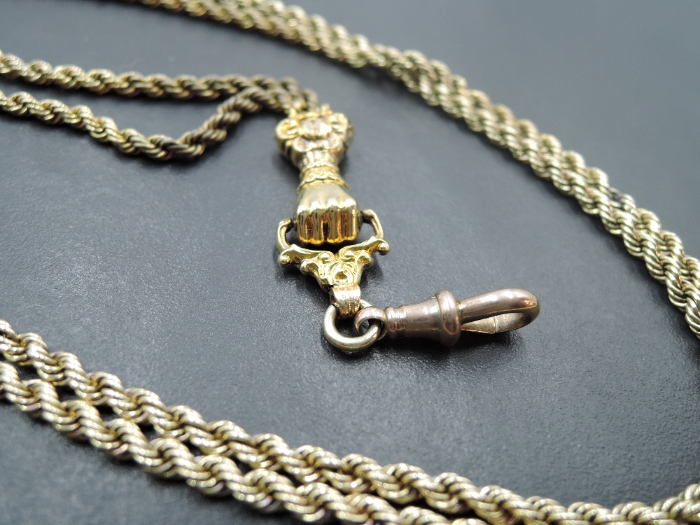 A yellow metal rope link guard chain having moulded clasped fist clasp fitting, no marks tests as - Image 2 of 3