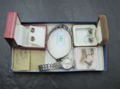 A small selection of silver and white metal jewellery including two pairs of stud earrings, a band