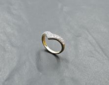 A 14ct gold wishbone ring having Cubic Zirconia decoration, size L & approx 2.1g