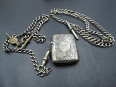 An HM silver vesta case and watch chain, with similar white metal watch chain