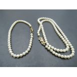 A short string of seed pearls of even form having 9ct gold clasp, approx 15' with matched single