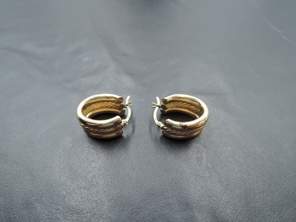 A pair of 9ct gold hoop earrings of triple hoop form, approx 3.9g - Image 2 of 2