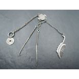 A Chinese silver gents chatelaine/Etui having moustache comb, tooth pick, ear cleaner and token,