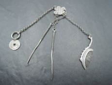 A Chinese silver gents chatelaine/Etui having moustache comb, tooth pick, ear cleaner and token,