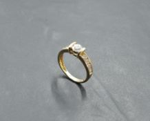 A Cubic Zirconia solitaire ring having open shoulders on a 14ct gold loop, size L & approx 2.8g