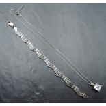 A silver articulated four bar wave style bracelet, approx 7.5' & 15.1g and a facetted crystal