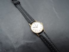 A lady's 1960's 9ct gold wrist watch by Tissot having Arabic numeral dial in a gold case on a