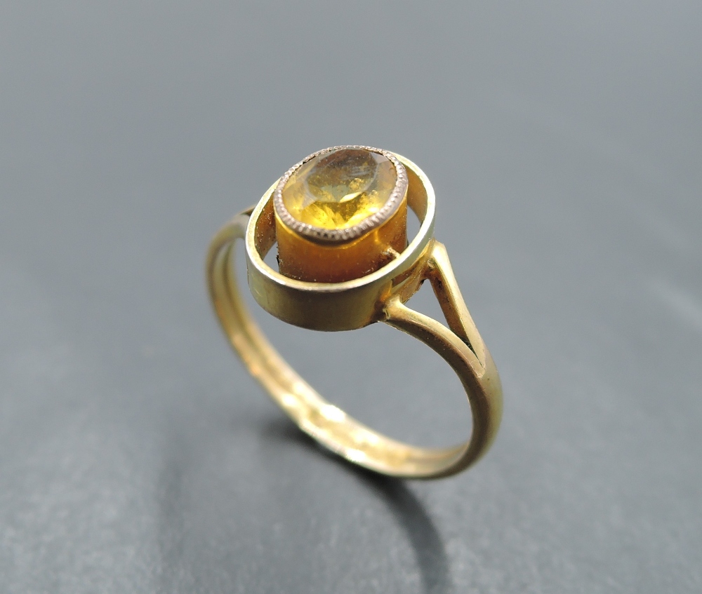 A small Victorian ring having oval citrine in open collared mount on 9ct gold loop, size K &