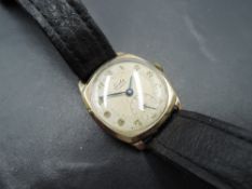 A gent's vintage 9ct gold Leda wrist watch having Arabic numeral dial with subsidiary seconds in
