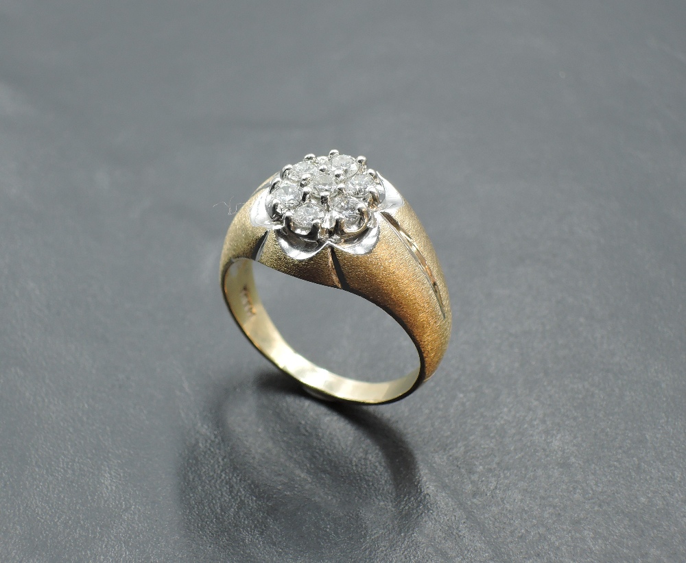 A gent's seven stone diamond cluster ring, total approx 1ct in a textured floral style heavy mount