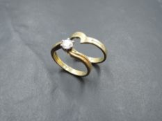 A diamond solitaire ring, approx 0.45ct in a six claw set mount to cross over shoulders on an 18ct