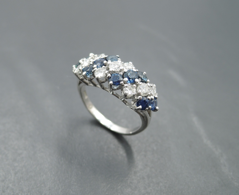 A sapphire and diamond seven row dress ring, total approx 1ct, having claw set panel mount on a