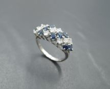 A sapphire and diamond seven row dress ring, total approx 1ct, having claw set panel mount on a