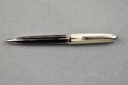 A Louis Cartier Ballpoint pen with Barrel having black ground and cap having white ground, with both