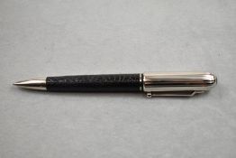 An Alfred Dunhill Ballpoint pen having leather encased barrel with ribbed silver cap, limited